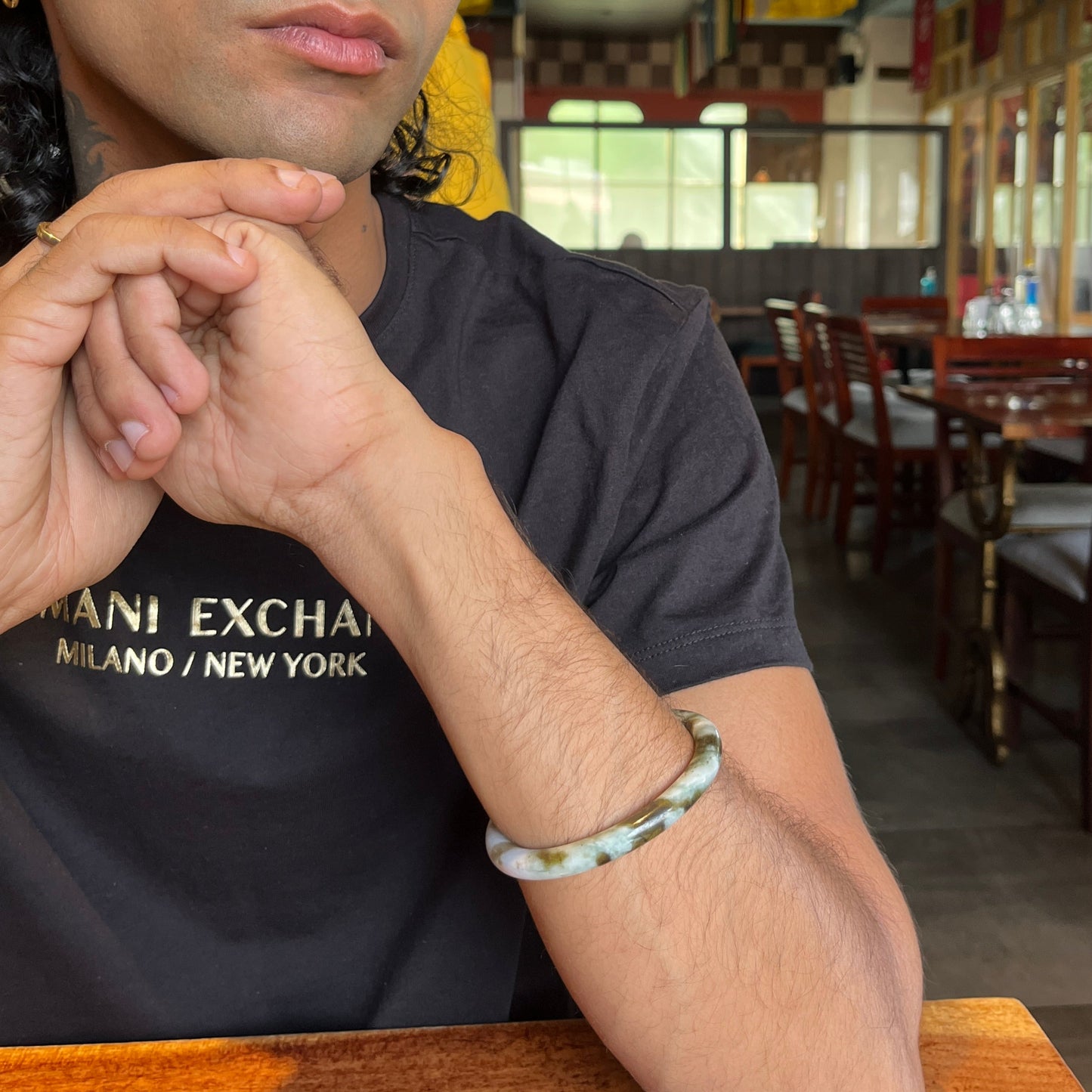man wearing jade bangle